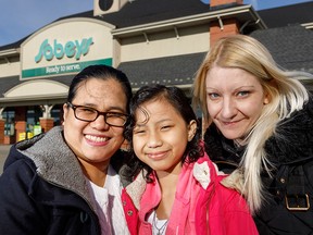 Ica Malabanan with mom Mylene and liver donor Kathy Shirley at the Sobeys where both women work.