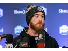 Hamilton Tiger-Cats quarterback Dane Evans talks with the media after arriving in Calgary for the Grey Cup on Tuesday. Photo by Azin Ghaffari/Postmedia.