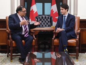 Prime Minister Justin Trudeau speaks with Calgary mayor Naheed Nenshi in his office on Parliament Hill in Ottawa on Thursday Nov. 21, 2019. THE CANADIAN PRESS/Adrian Wyld