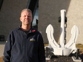 Scott Hausberg poses at the Naval Museum in Calgary in Friday, November 8, 2019. Hausberg, President of the Naval Museum of Alberta Society, is in front of one of the anchors from the HMCS Protecteur, a navy supply ship. He also served on the ship for a year and utiilzed the Forces at Work program after he left the Navy.