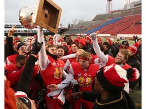 The Calgary Dinos celebrate after defeating the University of Saskatchewan Huskies 29-4 in the Hardy Cup at McMahon Stadium on Saturday November 9, 2019 Gavin Young/Postmedia