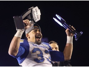 Winnipeg Blue Bombers Andrew Harris celebrates after being named MVP and top Canadian player in the 107th Grey Cup at McMahon stadium in Calgary on Sunday, November 24, 2019. Darren Makowichuk/Postmedia
