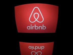 (FILES) This file photo taken on March 02, 2017 shows the logo of online lodging service Airbnb displayed on a computer screen in Paris.