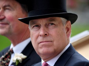 Britain's Prince Andrew arrives by horse and carriage on ladies day at Royal Ascot, June 20, 2019.