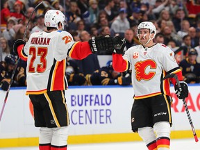Calgary Flames defenceman TJ Brodie celebrates his goal with Sean Monahan in the first period against the Buffalo Sabres at KeyBank Center on Wednesday, Nov. 27, 2019.