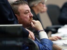 Calgary city Councillor Joe Magliocca listens during a public input session on budget cuts and tax increases at Calgary city council, Monday November 25, 2019. Gavin Young/Postmedia