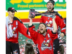The Calgary Roughnecks' Dane Dobbie raises the Champions Cup after winning the NLL title back on May 25. File Photo Al Charest/Postmedia.