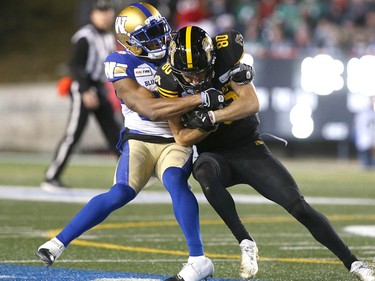 Hamiton receiver Jaelin Acklin is tackled in the third qurarter during the 107th Grey Cup CFL Championship football game in Calgary at McMahon Stadium Sunday, November 24, 2019. Jim Wells/Postmedia