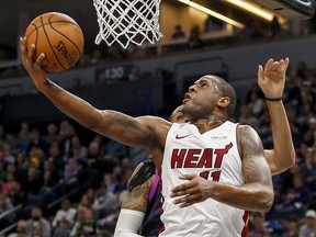 Miami Heat guard Dion Waiters (11) drives to the basket past Minnesota Timberwolves forward Keita Bates-Diop (31) Friday, April 5, 2019, in Minneapolis. (AP Photo/Bruce Kluckhohn)