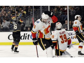 CP-Web.  Vegas Golden Knights center Paul Stastny, left, celebrates after scoring against the Calgary Flames during the second period of an NHL hockey game Sunday, Nov. 17, 2019, in Las Vegas.