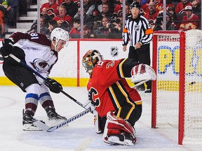 Vladislav Kamenev of the Colorado Avalanche puts the puck behind Flames goaltender David Rittich in the second period on Tuesday, Nov. 19, 2019.