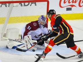Colorado Avalanche Philipp Grubauer with a save on Derek Ryan of the Calgary Flames during NHL hockey in Calgary on Tuesday November 19, 2019.