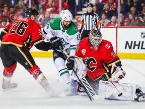 Flames goaltender Cam Talbot makes a save against the Dallas Stars in the second period at Scotiabank Saddledome on Wednesday, Nov. 13, 2019.
