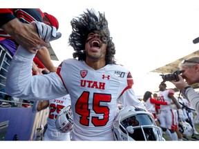 Nov 2, 2019; Seattle, WA, USA; Utah Utes wide receiver Samson Nacua (45) high-fives fans after a win against the Washington Huskies at Husky Stadium. Mandatory Credit: Jennifer Buchanan-USA TODAY Sports ORG XMIT: USATSI-404368