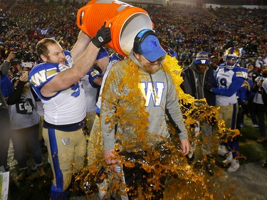 Winnipeg Blue Bombers coach, Mike O'Shea gets the gatorade after beating the  Hamilton Tiger-Cats in the 107th Grey Cup at McMahon stadium in Calgary on Sunday, November 24, 2019. Darren Makowichuk/Postmedia