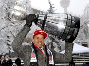 Jon Cornish has some fun as the Grey Cup was paraded down Stephen Avenue mall to the Olympic Plaza to kick off the 107th Grey Cup festivities in Calgary on Tuesday, November 19, 2019. Darren Makowichuk/Postmedia
