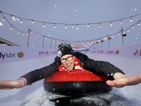 Geordie MacLeod, Grey Cup Festival Executive Director hams it up on the Jiffy Lube Tube Slide as media had a tour of the Festival Zone at Stampede Park wich is open to the public tomorrow as part of the 107th Grey Cup festivities in Calgary on Tuesday, November 19, 2019. Darren Makowichuk/Postmedia