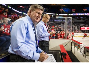 Nov 7, 2019; Calgary, Alberta, CAN; Calgary Flames head coach Bill Peters looks on from the bench during the warmups prior to the game against the New Jersey Devils at Scotiabank Saddledome. Mandatory Credit: Sergei Belski-USA TODAY Sports ORG XMIT: USATSI-405238