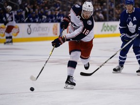 Oct 21, 2019; Toronto, Ontario, CAN; Columbus Blue Jackets forward Pierre-Luc Dubois (18) shoots the puck against the Toronto Maple Leafs during the second period at Scotiabank Arena. Mandatory Credit: John E. Sokolowski-USA TODAY Sports ORG XMIT: USATSI-405122