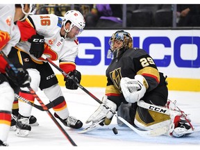 Oct 12, 2019; Las Vegas, NV, USA; Vegas Golden Knights goaltender Marc-Andre Fleury (29) stops Calgary Flames center Tobias Rieder (16) during the first period at T-Mobile Arena. Mandatory Credit: Stephen R. Sylvanie-USA TODAY Sports ORG XMIT: USATSI-405067