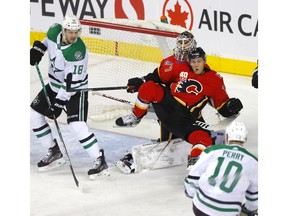 Calgary Flames, Mark Jankowski  battles Dallas Stars, Corey Perry in first period action of at the Scotiabank Saddledome in Calgary on Wednesday, November 13, 2019. Darren Makowichuk/Postmedia