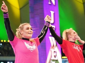 After our match, Lacey and I both raise each other’s hands in front of over 40,000 people. We all won.
