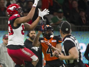 VANCOUVER. November 02 2019. BC Lions #4 Garry Peters looks up as Calgary Stampeders #80 Aaron Peck hauls in a pas during a regular season CFL football game at BC Place, Vancouver, November 02 2019.   Gerry Kahrmann  /  PNG staff photo) 00059263A [PNG Merlin Archive]