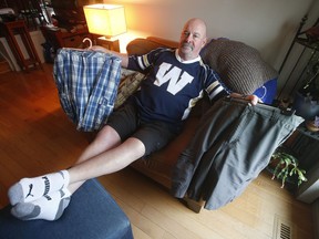 Winnipeg Blue Bomber fan Chris Matthews, who has been wearing shorts daily since the 2001 Grey Cup in Calgary, shows off some of his shorts in his living room in Winnipeg Wednesday, November 20, 2019. Back in 2001 Matthews said he would wear shorts until the Winnipeg Blue Bombers win the Grey Cup.