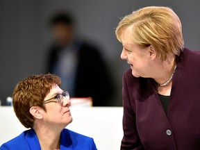 German Chancellor Angela Merkel talks to party chairwoman Annegret Kramp-Karrenbauer during the Christian Democratic Union (CDU) party congress in Leipzig, Germany, November 22, 2019. (REUTERS/Matthias Rietschel)