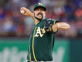 Athletics pitcher Mike Fiers throws against the Rangers at Globe Life Park in Arlington, Texas, on Sept. 14, 2019.