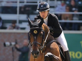 Canada’s Nicole Walker rides Falco Ban Spieveld at the RBC Grand Prix of Canada event during the Spruce Meadows National in Calgary, on June 8, 2019.