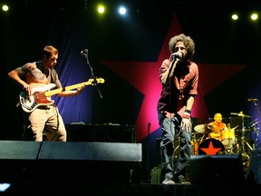 (L-R) Musicians Tim Commerford, Zack De La Rocha and Brad Wilk from the band "Rage Against the Machine" perform during Day 3 of the Coachella Music Festival held at the Empire Polo Field on April 29, 2007, in Indio, Calif.