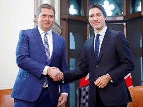 Conservative Party Leader Andrew Scheer shakes hands with Prime Minister Justin Trudeau on Parliament Hill in Ottawa, on Tuesday, Nov. 12, 2019.