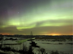 Northern lights along the Red Deer River west of Innisfail, Alta., on Wednesday March 18, 2015.