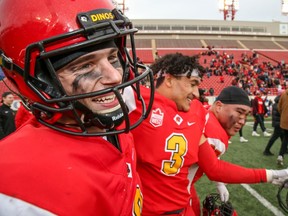 University of Calgary defensive back Nick Statz was all smiles after his interception on the final play of the game, sealing a one point victory for the Dinos as they defeated the University of Manitoba Bisons in the Canada West Hardy Cup semifinal on Saturday. Photo by SEAN LIBIN/Special to Postmedia.