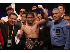 LAS VEGAS, NEVADA - JANUARY 19:  Manny Pacquiao celebrates after defeating Adrien Broner by unanimous decision during the WBA welterweight championship at MGM Grand Garden Arena on January 19, 2019 in Las Vegas, Nevada.