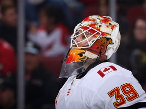 GLENDALE, ARIZONA - DECEMBER 10: Goaltender Cam Talbot #39 of the Calgary Flames looks down ice during the first period of the NHL game against the Arizona Coyotes at Gila River Arena on December 10, 2019 in Glendale, Arizona. The Flames defeated the Coyotes 5-2.  (Photo by Christian Petersen/Getty Images)