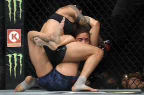 UFC women’s bantamweight champion Amanda Nunes (top) grapples with Germaine de Ranamie during UFC 245 at T-Mobile Arena on Dec. 14, 2019, in Las Vegas.