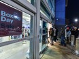 People enter the Sunridge Best Buy just as the store opens at 6 a.m. for Boxing Day on Thursday, December 26, 2019. Azin Ghaffari/Postmedia