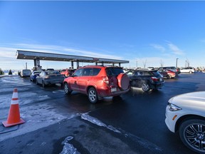 People wait in line to gas up at Costco Gas Station East Hills on Monday, December 30, 2019. Azin Ghaffari/Postmedia