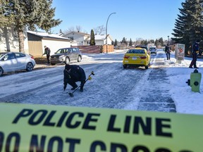 Police are investigating the scene of a shooting in Rundlemere Road N.E. using metal detectors to look for bullet cases on Monday, December 30, 2019.