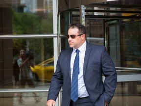 James Othen walks out of the Calgary Courts Centre Monday, August 21 2017.