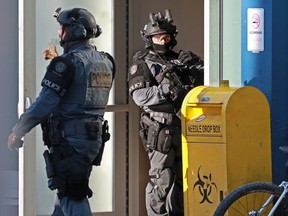 Police deal with an incident inside the Safeworks supervised consumption site at the Sheldon Chumir Centre in downtown Calgary, Monday, December 2, 2019.  Gavin Young/Postmedia