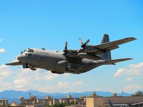In this July 14, 2015 photograph courtesy of the US Air Force, a C-130 Hercules takes off during a training exercise at Yokota Air Base, Japan.