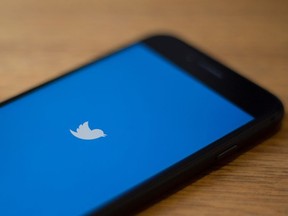 In this file photo taken on July 10, 2019 the Twitter logo is seen on a phone in in Washington, D.C.