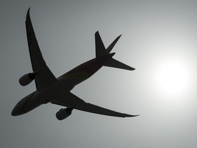 A plane is silhouetted as it takes off from Vancouver International Airport in Richmond, B.C., Monday, May 13, 2019. New polling results suggest many people boarding flights this holiday season don't know about the Liberal government's new regime outlining air passengers' rights.