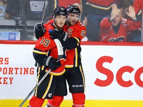 Calgary Flames Matthew Tkachuk celebrates with teammate Mark Giordano after his goal against the Los Angeles Kings during NHL hockey in Calgary on Tuesday October 8, 2019. Al Charest / Postmedia