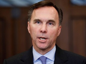 Finance Minister Bill Morneau speaks to media in the House of Commons foyer on Parliament Hill in Ottawa on Dec. 9, 2019.