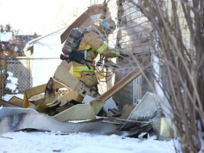 Calgary firefighters investigate the cause of a fire early Sunday morning in the 2400 blk of 6 Ave NW in Calgary on Sunday, December 15, 2019. No one was home at the time of the fire and according to CFD, the interior smoke alarms were activated. Jim Wells/Postmedia