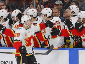 Calgary Flames forward Andrew Mangiapane celebrates with teammates after scoring a goal in the first period against the Edmonton Oilers at Rogers Place on Friday night. Photo by Perry Nelson/USA TODAY Sports.